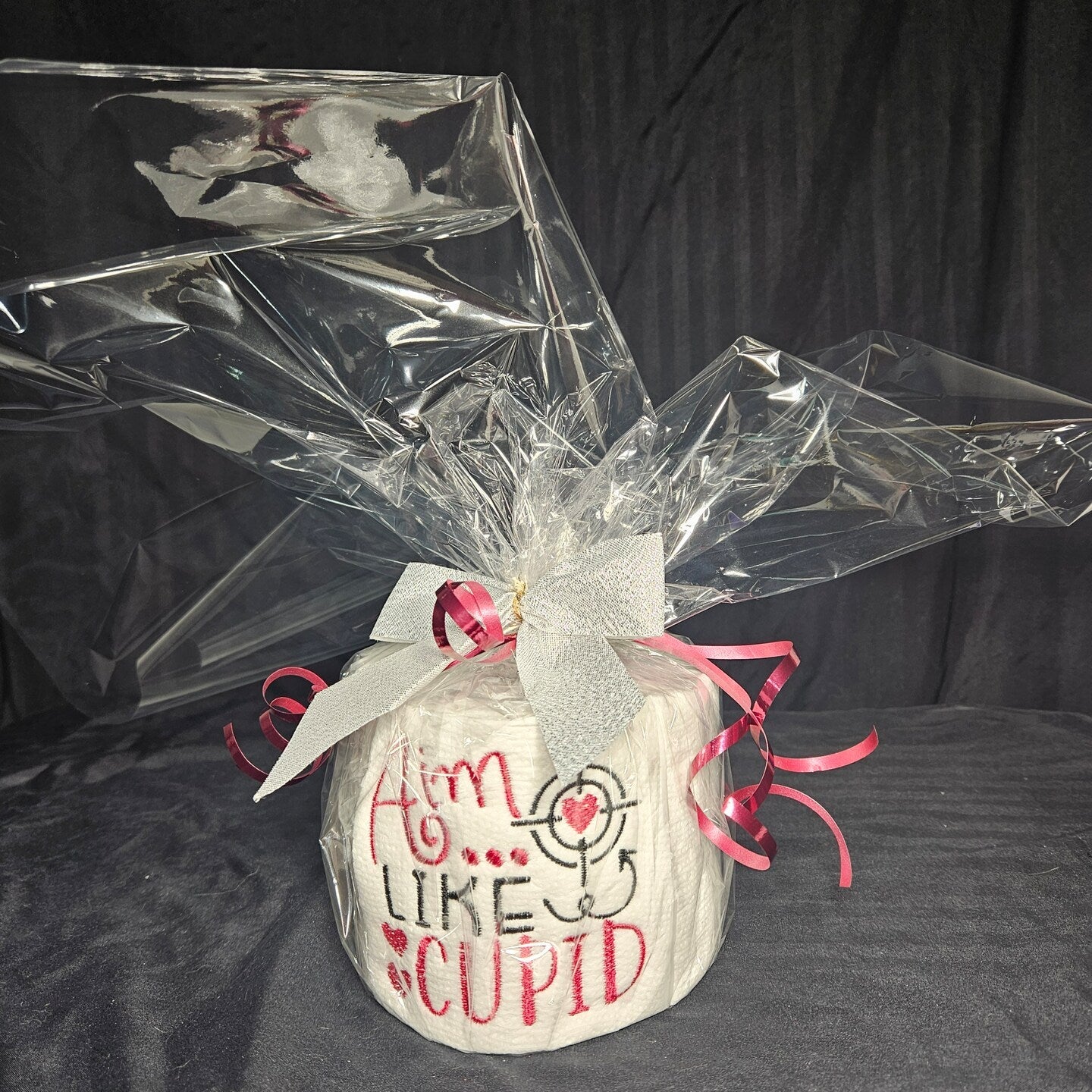 Wrapped and with a bow embroidered toilet paper