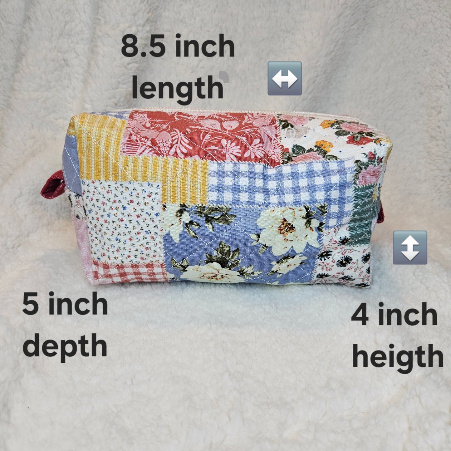 Patchwork fabric boxy bag with measurements on a gray background