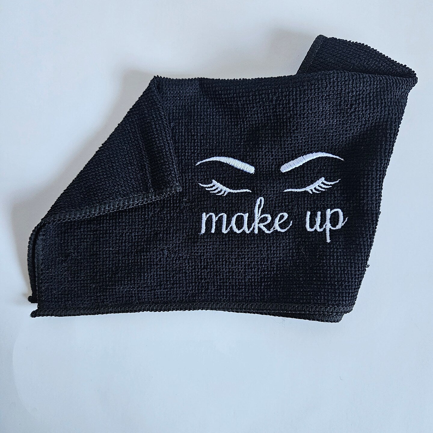 Folded black make up cloth
