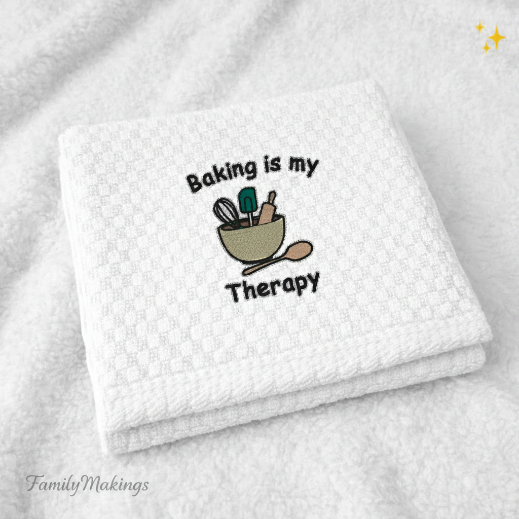 White towel with 'Baking is my Therapy' embroidery on a white background