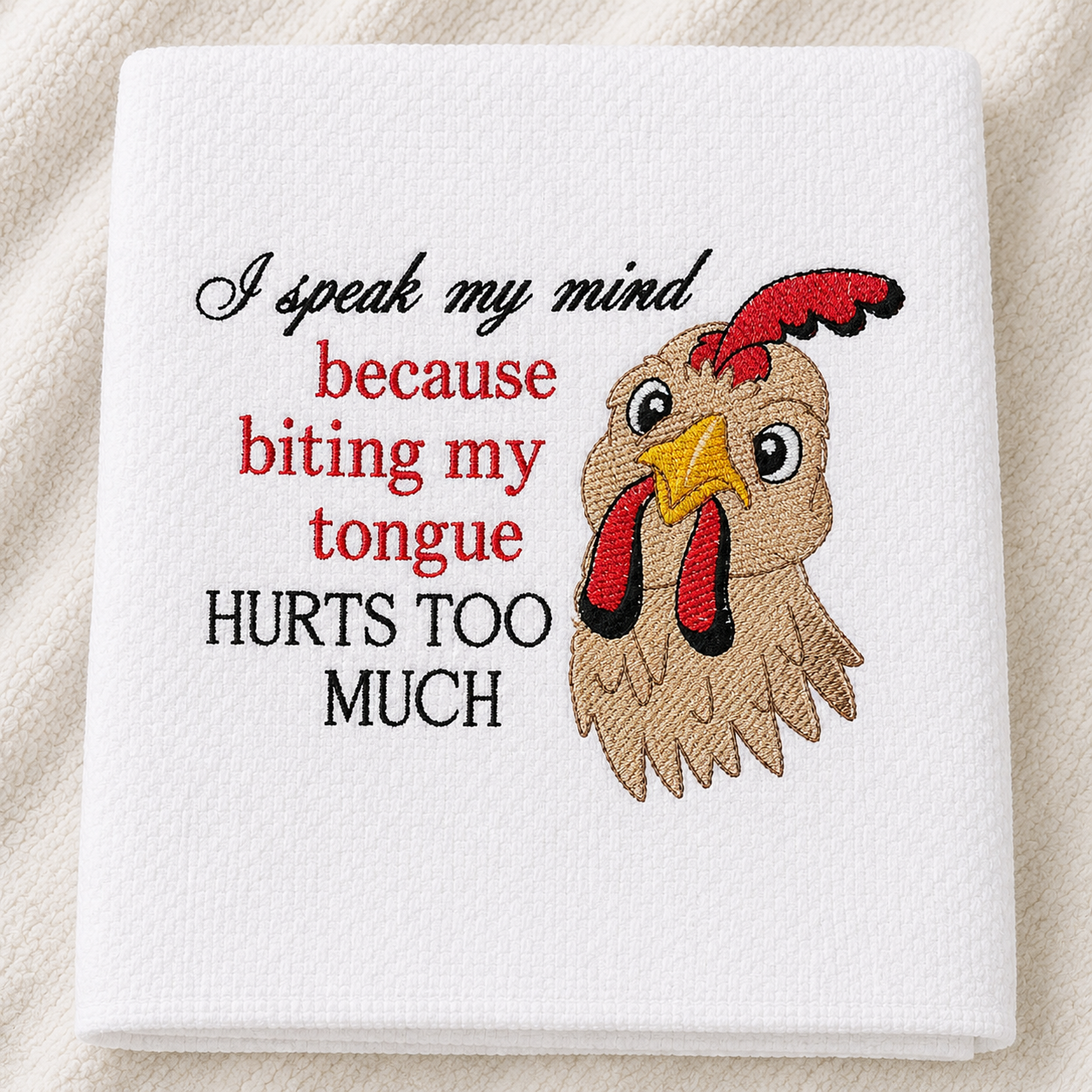 Embroidered towel with a rooster and humorous text on a white background
