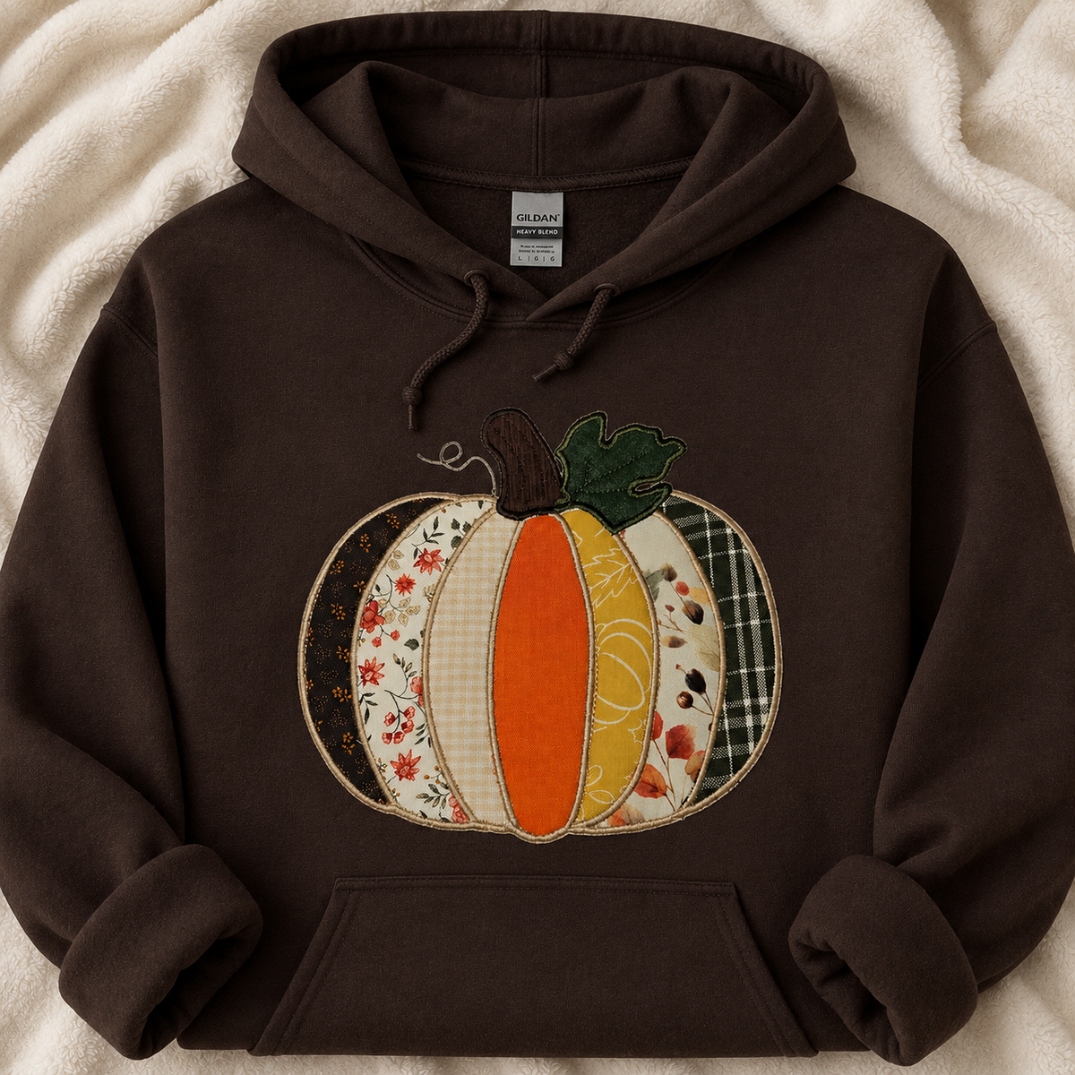 Applique pumpkin on a chocolate Gildan hoodie