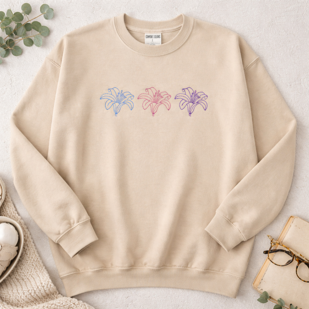 Sand sweatshirt with colorful floral designs on a light background