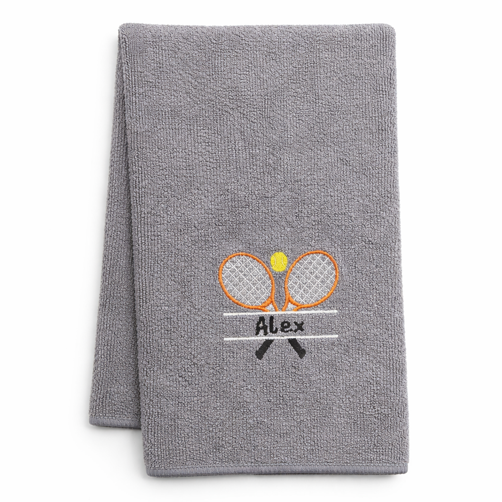 Gray microfiber towel with embroidered tennis rackets and ball design on a white background