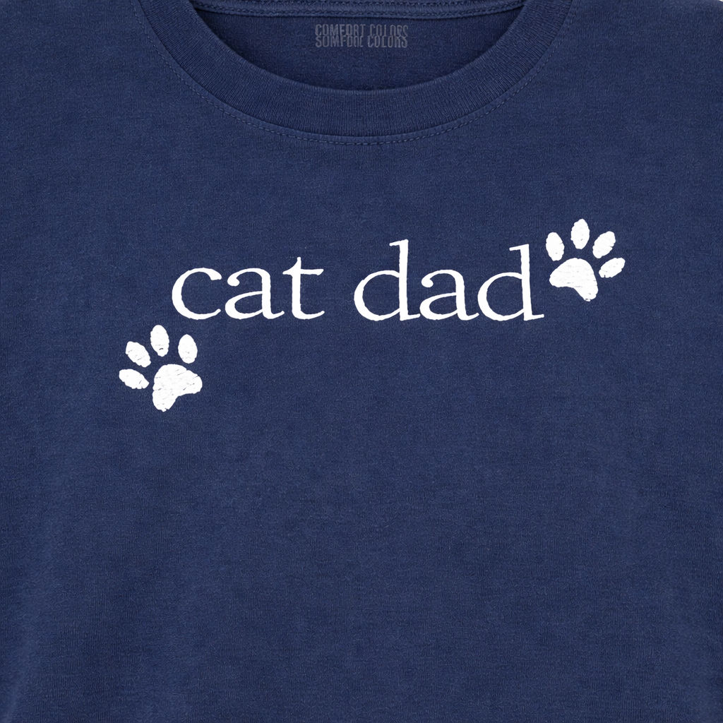 Navy t-shirt with 'cat dad' embroidered text and paw prints 