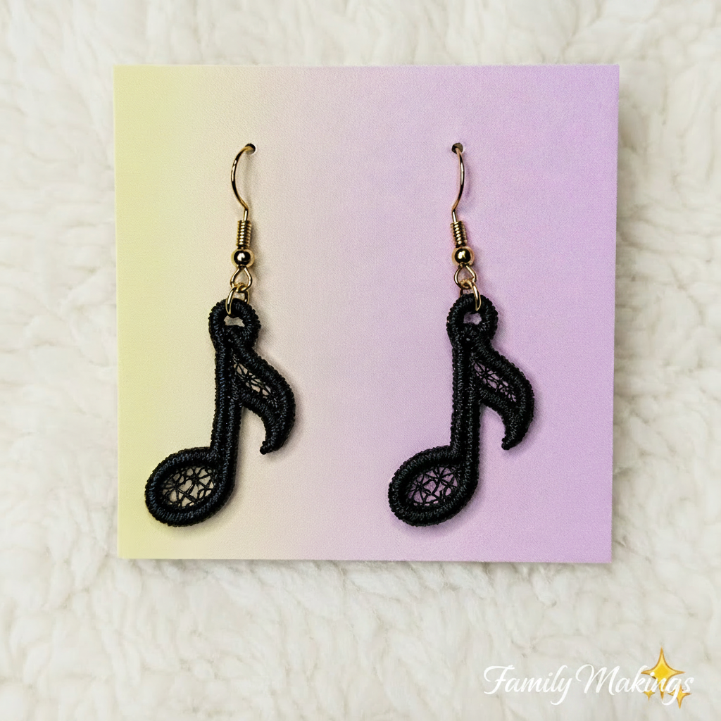 Black colored embroidered eighth note earrings on a card