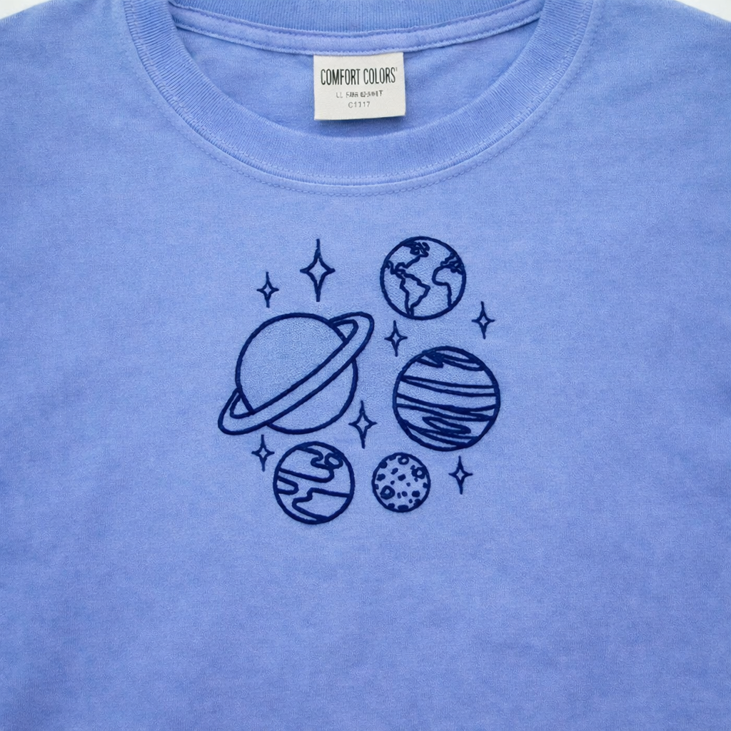 Hydrangea t-shirt with space-themed design and 'Comfort Colors' label.