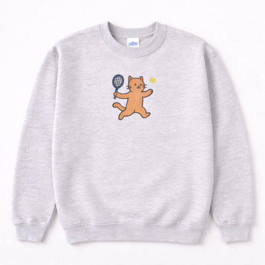 Ash gray sweatshirt with a cartoon cat holding a tennis racket and ball on a white background