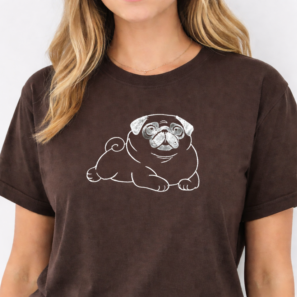 Person wearing an espresso t-shirt with a white pug design on a plain background