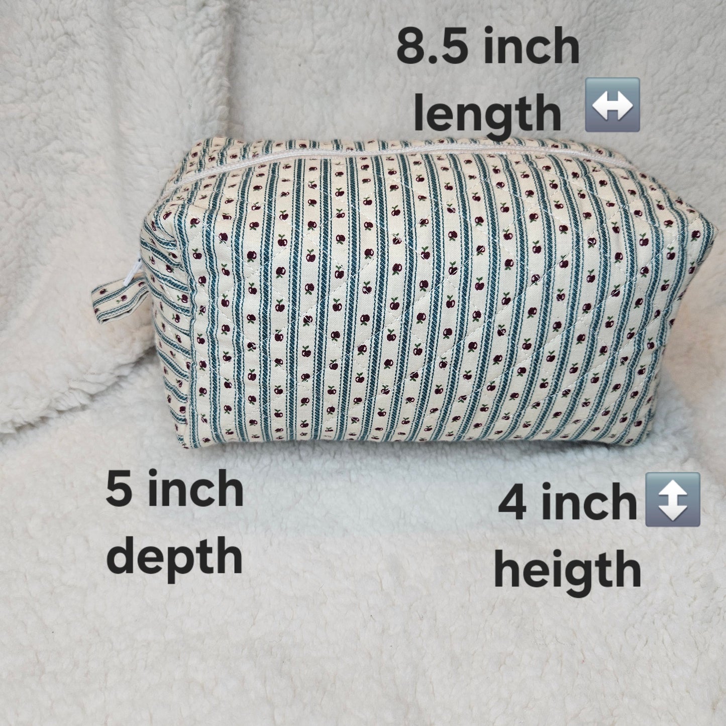 Rectangular fabric pouch with measurements on a textured surface