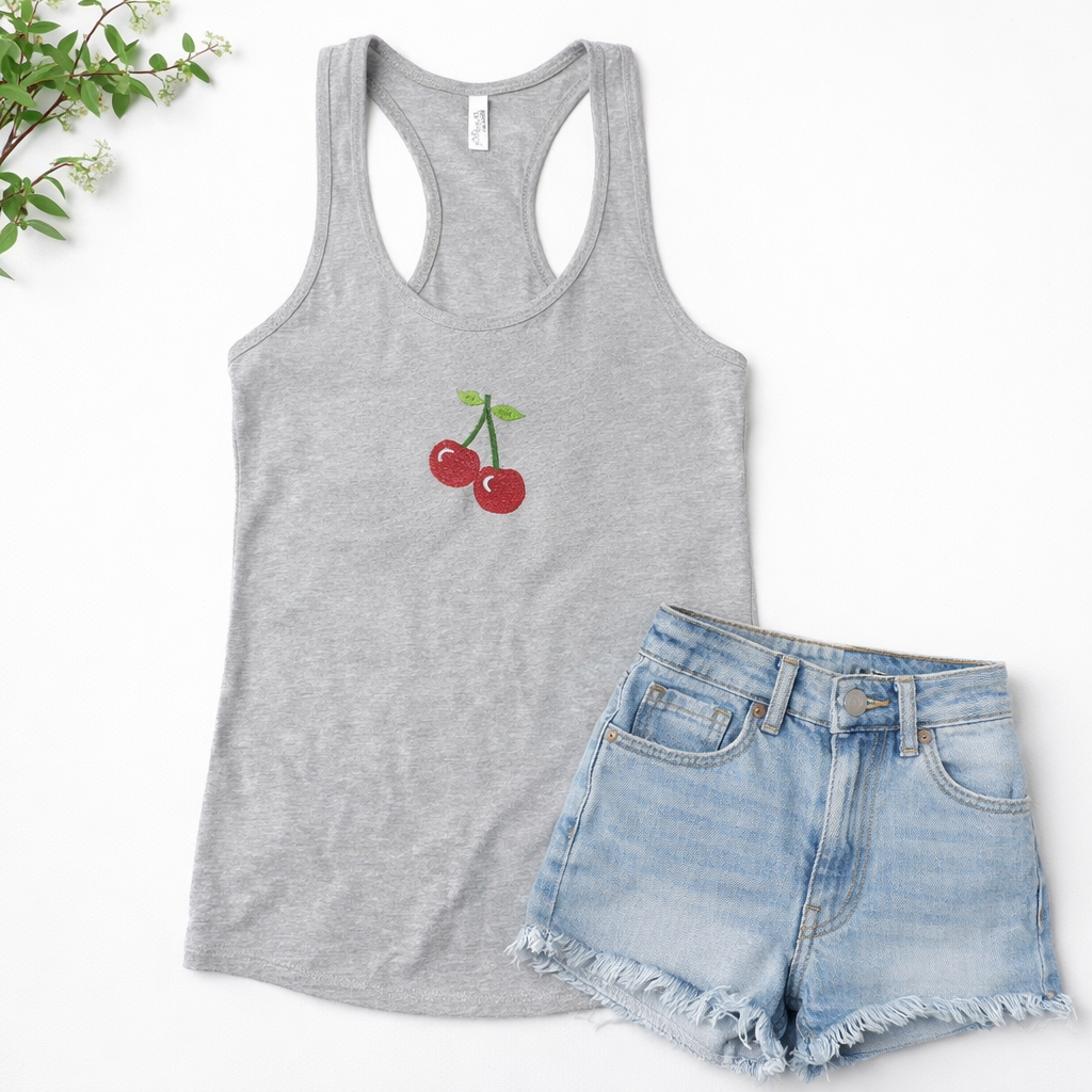 Heather gray tank top with cherry design and denim shorts on a white background