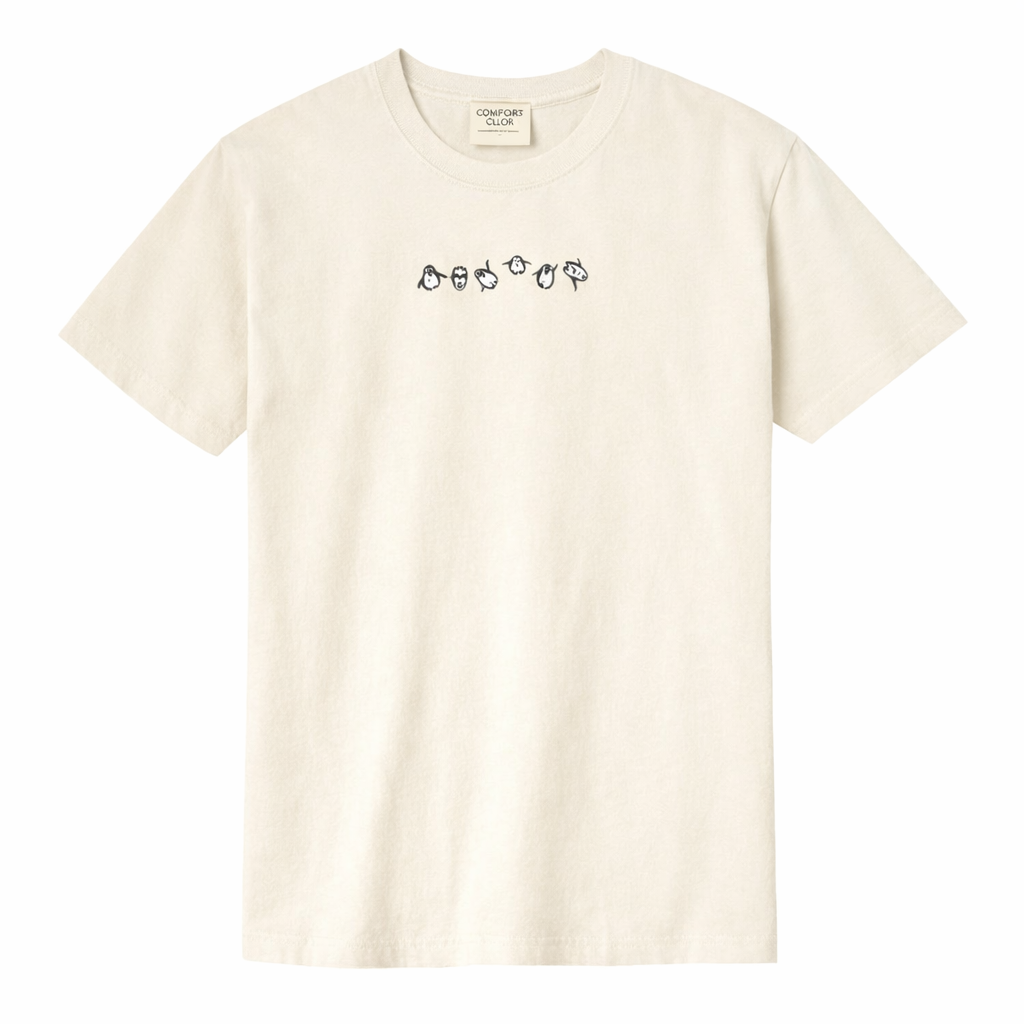 Ivory t-shirt with small, embroidered design on a white background