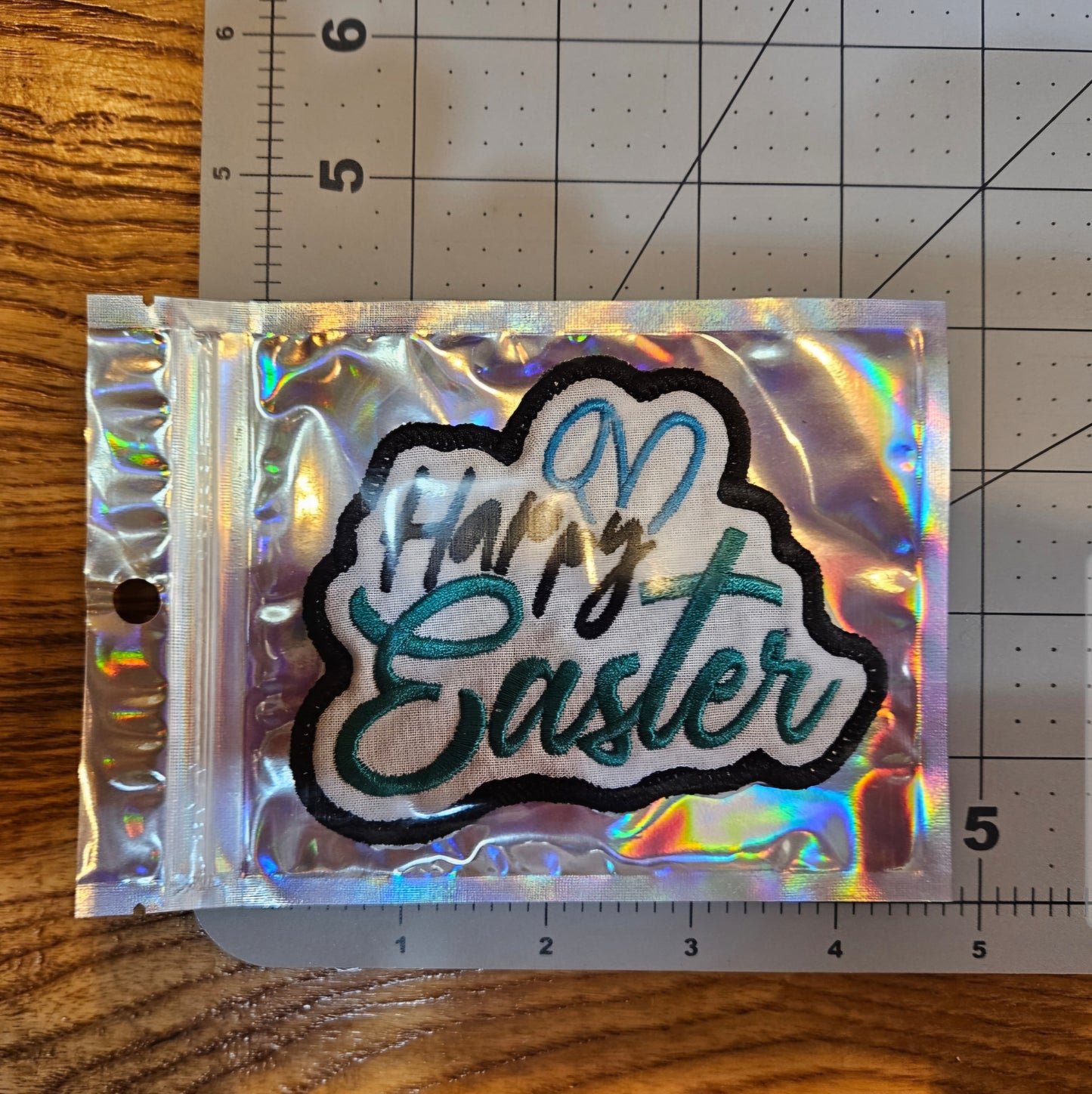 Patch with 'Happy Easter' text on a cutting mat