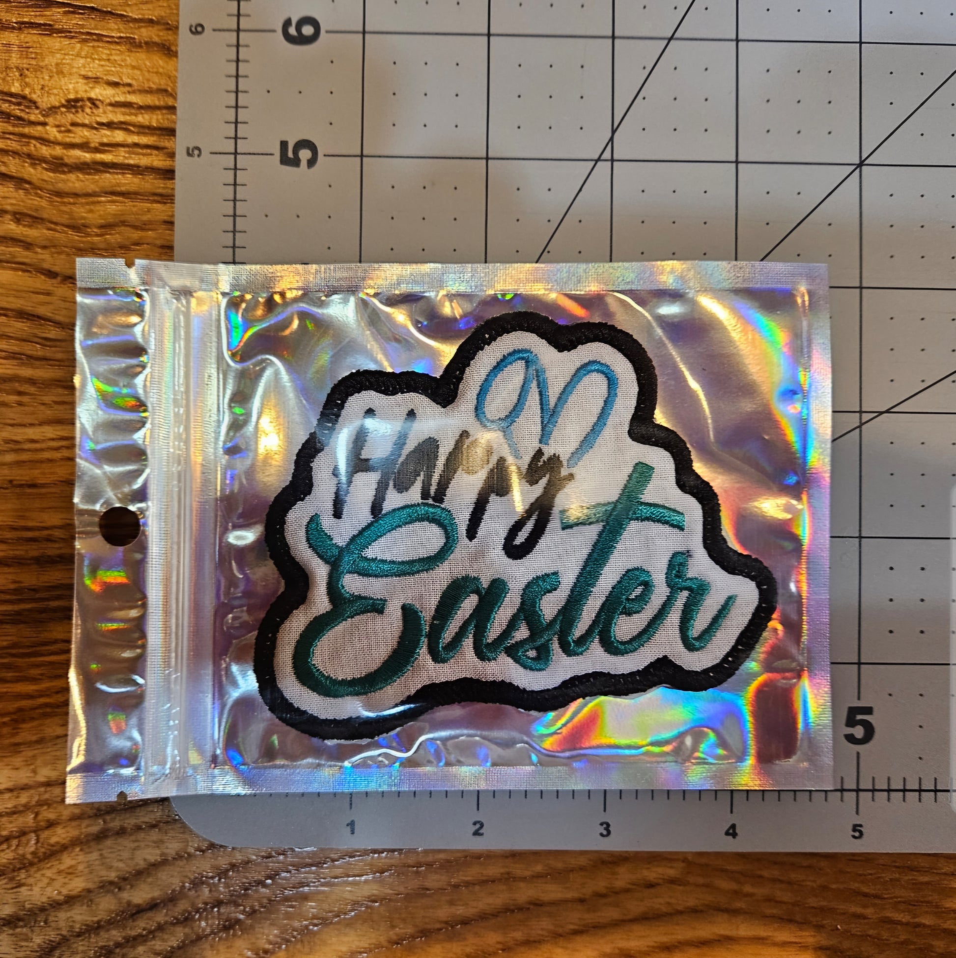Patch with 'Happy Easter' text on a cutting mat