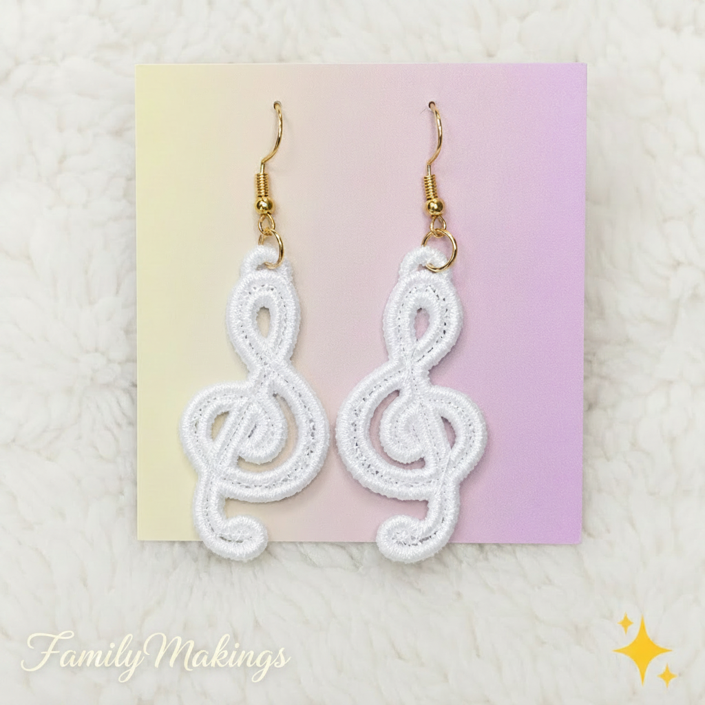 White Treble Clef embroidered earrings on a card