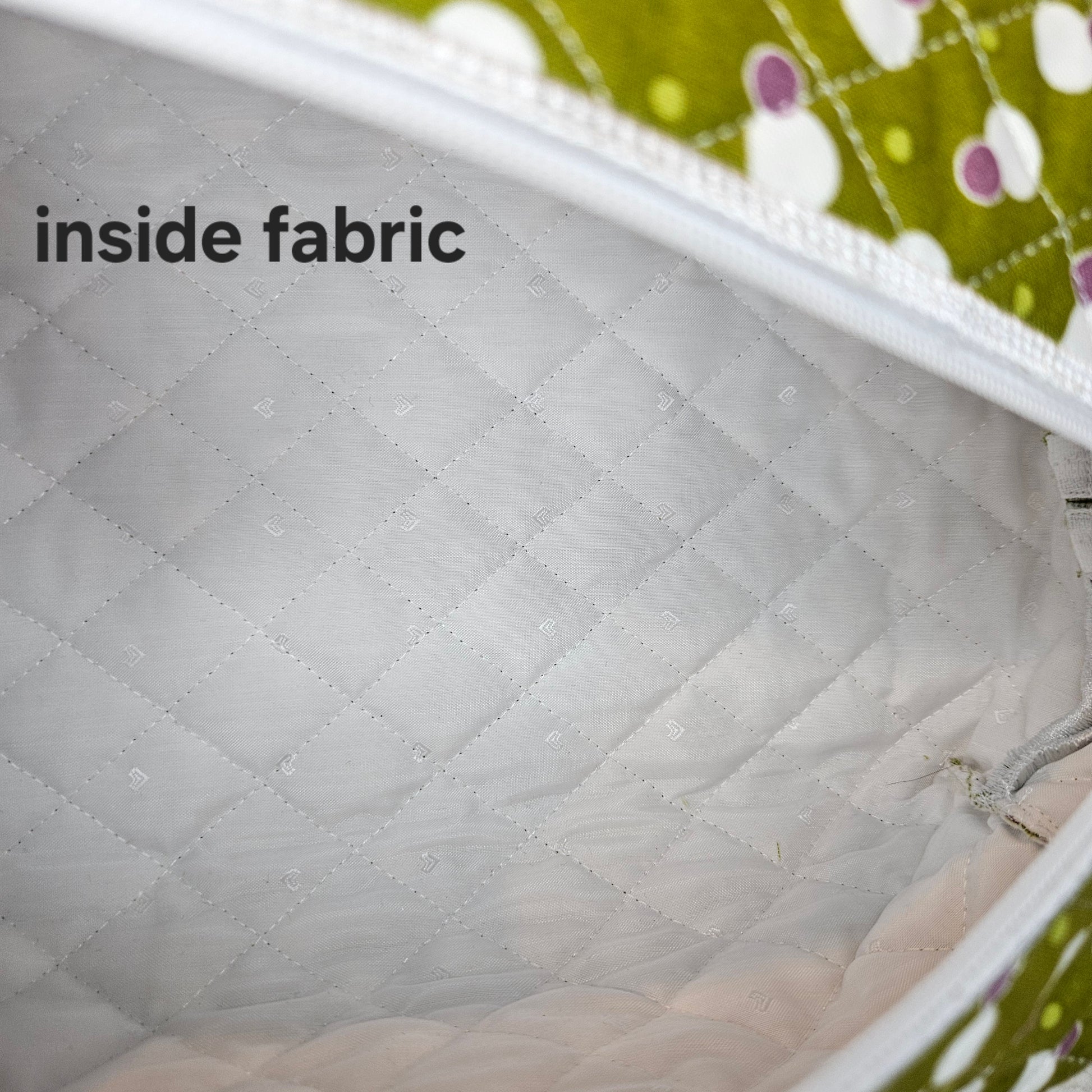 Close-up of quilted fabric with 'inside fabric' text overlay