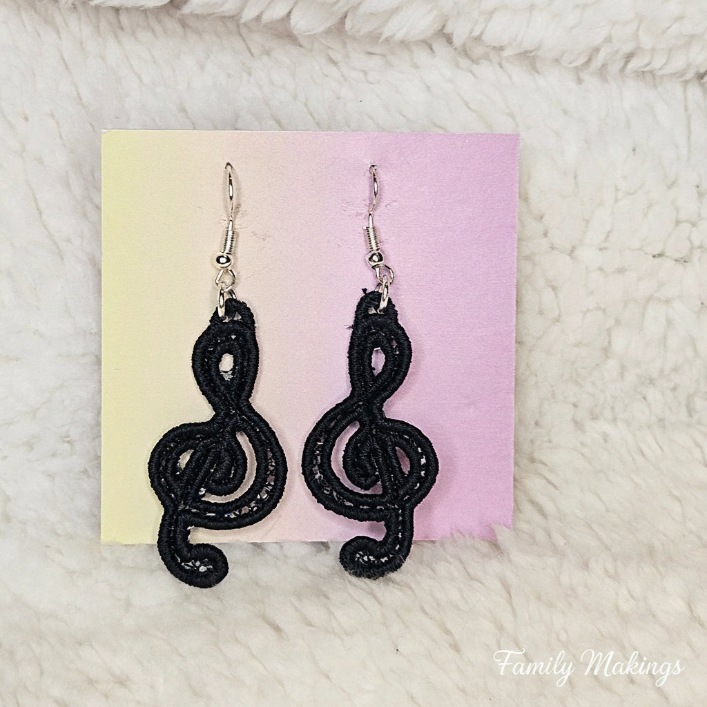 Black Treble Clef embroidered earrings on a card