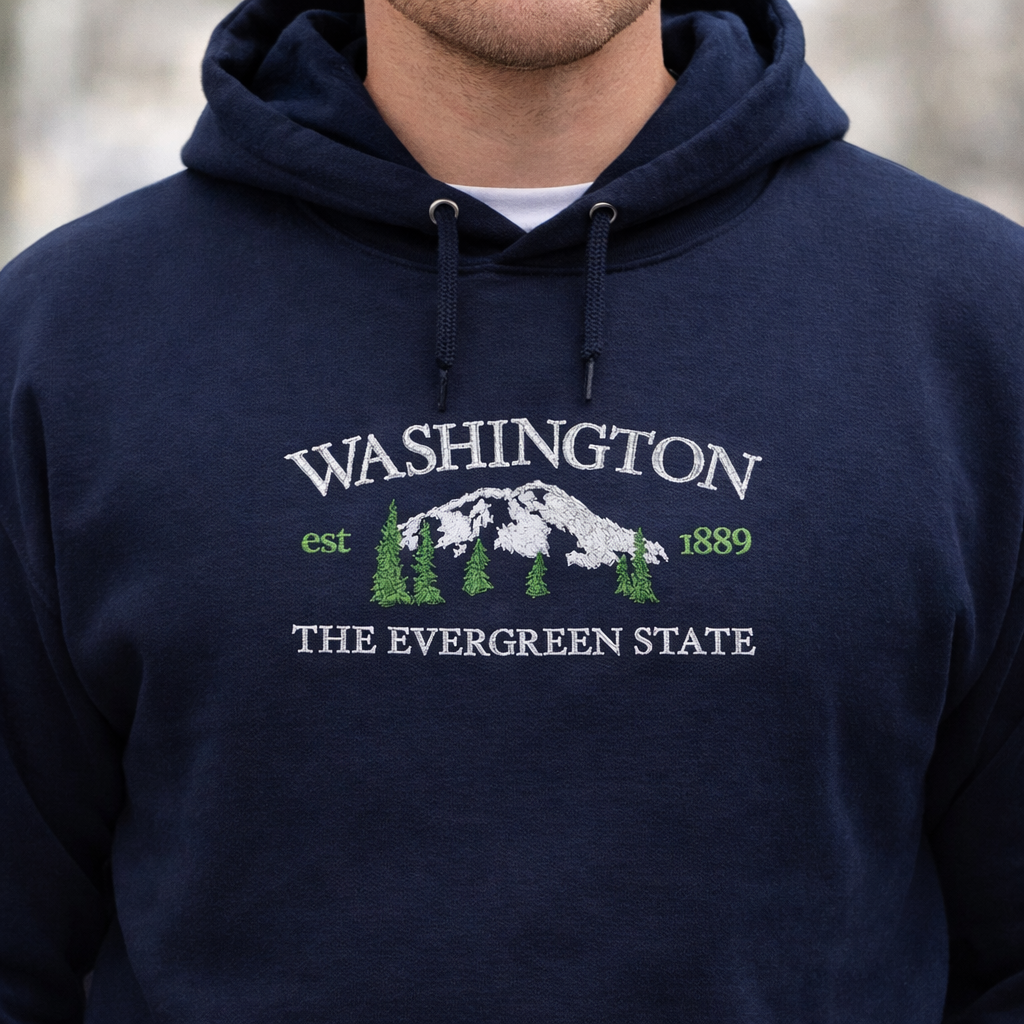Navy blue hoodie with 'Washington The Evergreen State' text and mountain graphic.