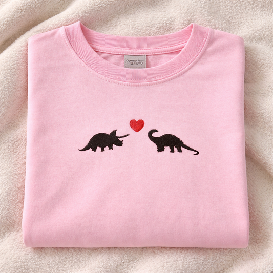 Blossom t-shirt with dinosaur design on a white background