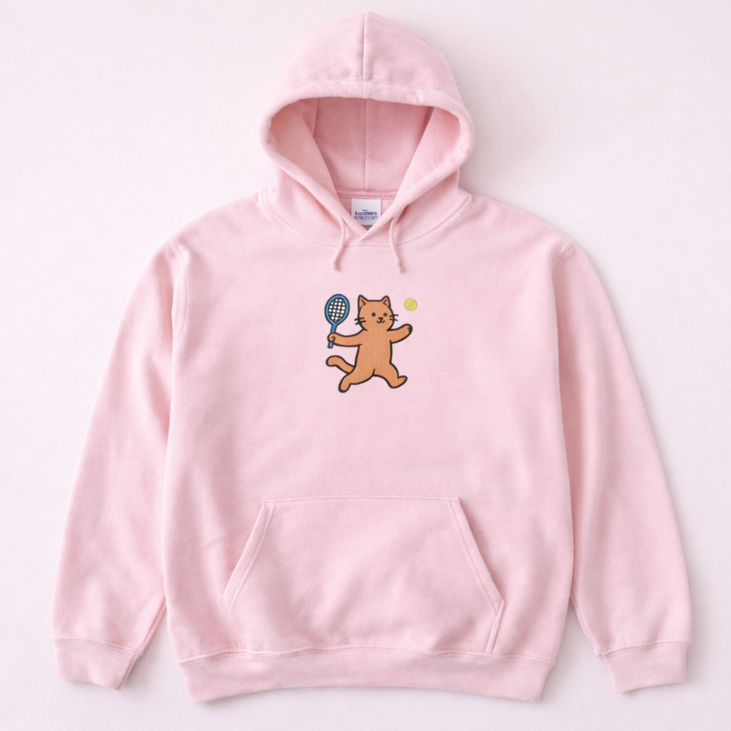 Light pink hoodie with a cat holding a tennis racket and ball design on a white background