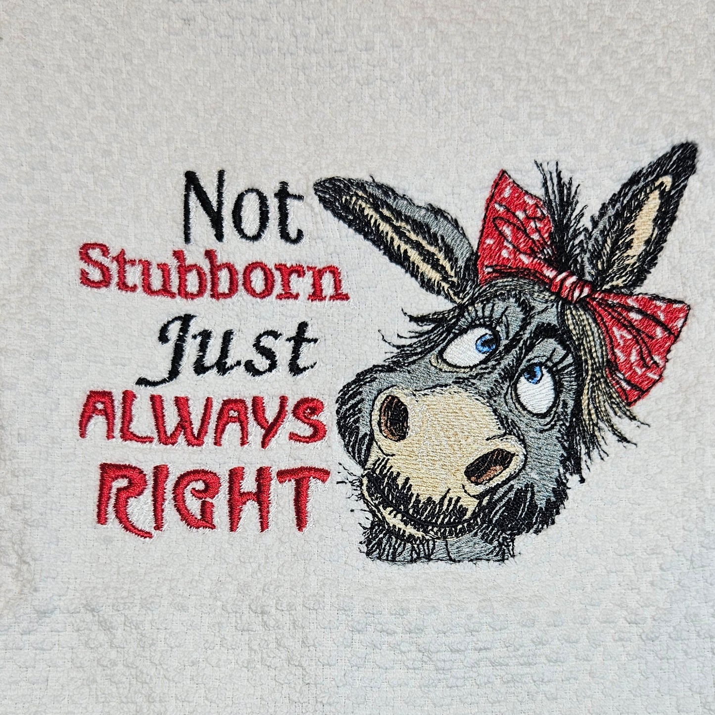 Towel with a donkey graphic and text on white background