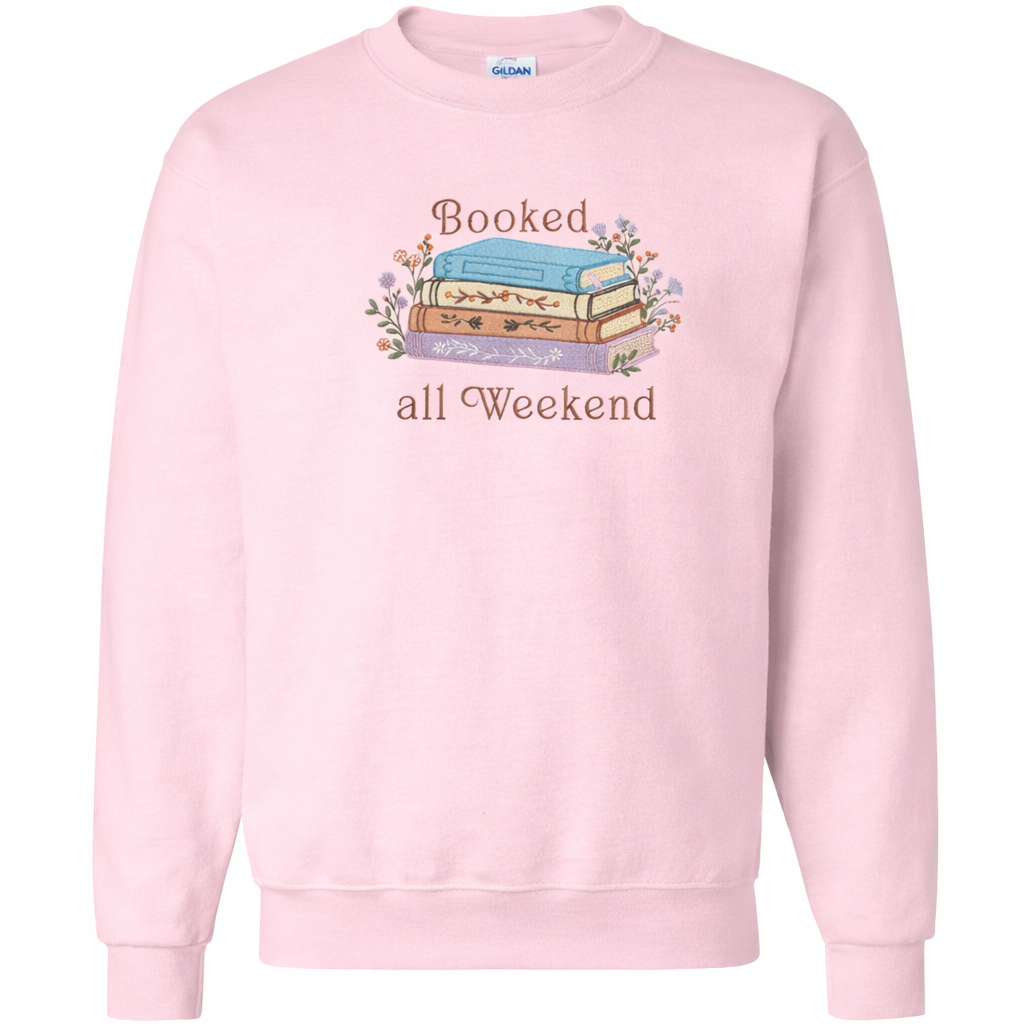 Light pink sweatshirt with 'Booked all Weekend' text and book illustration on a white background