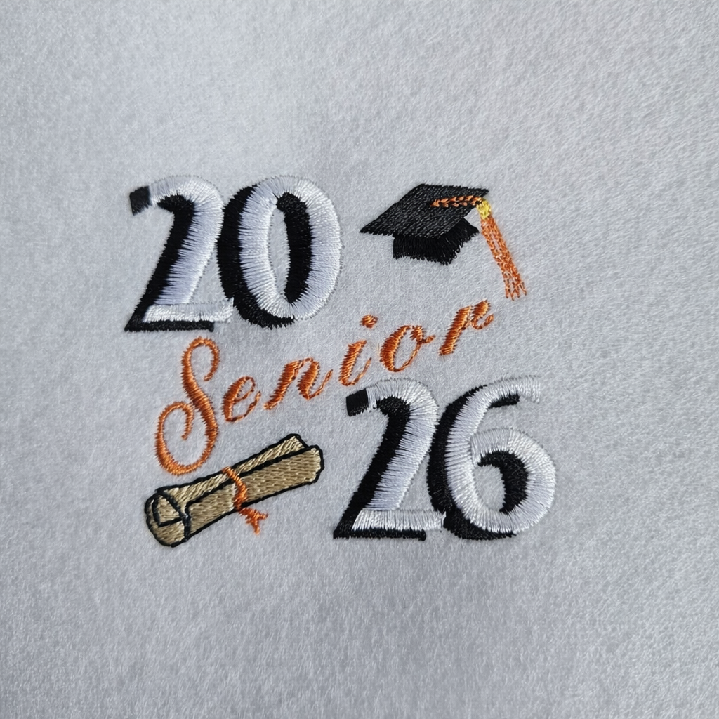 Embroidered design with '20 Senior 26' text and graduation cap and diploma on a gray background