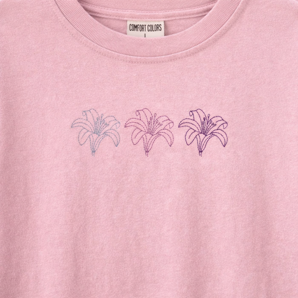 Blossom t shirt with embroidered lily designs and 'Comfort Colors' label.