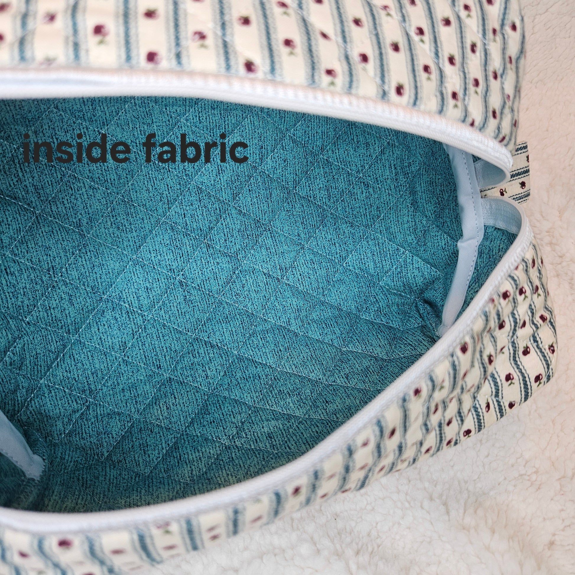 Close-up of a fabric product with 'inside fabric' text on a textured surface.